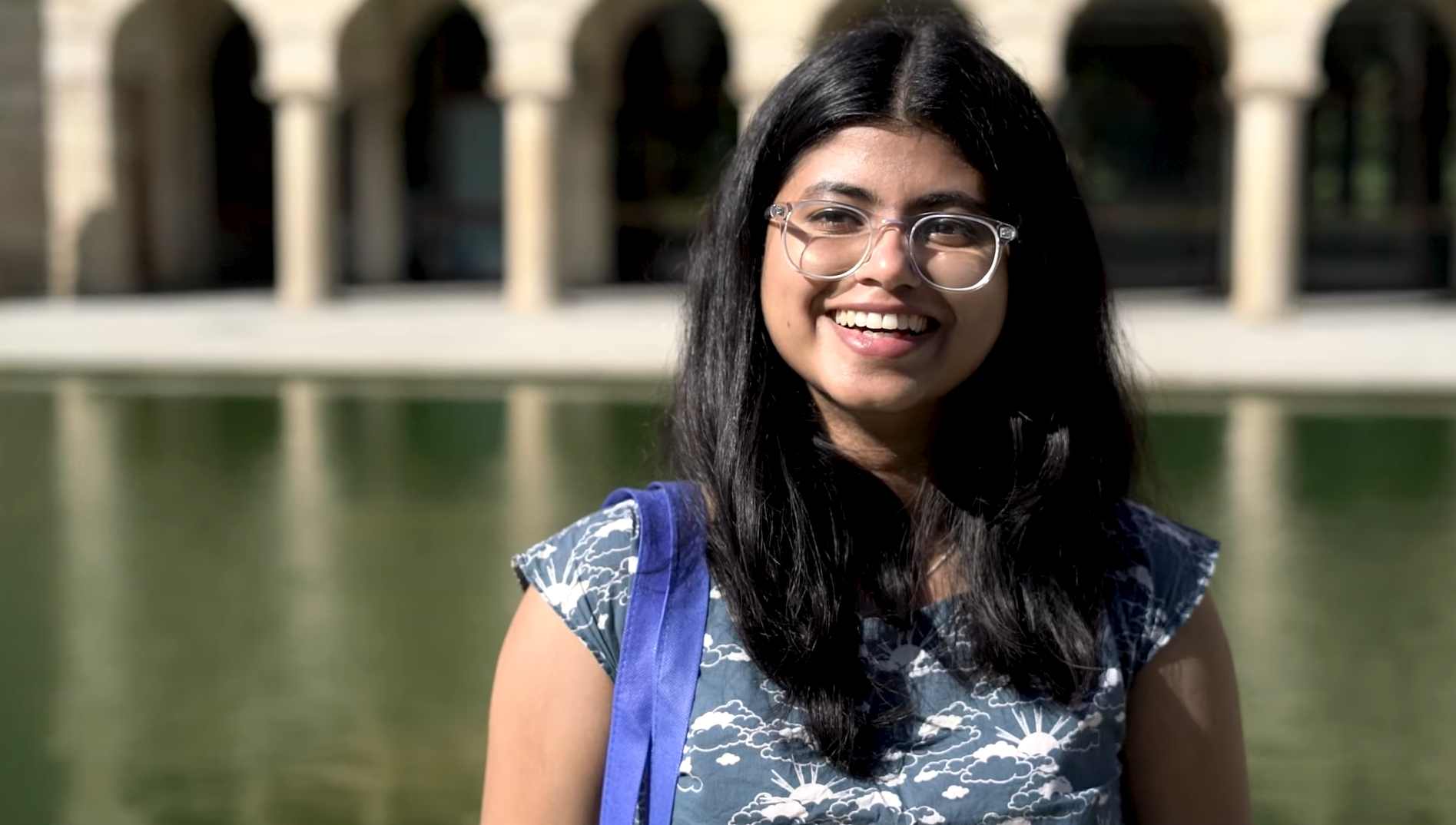 Student Amy Vidyuth talking in front of UWA pond about her experience as an international student studying the Master of Environmental Science